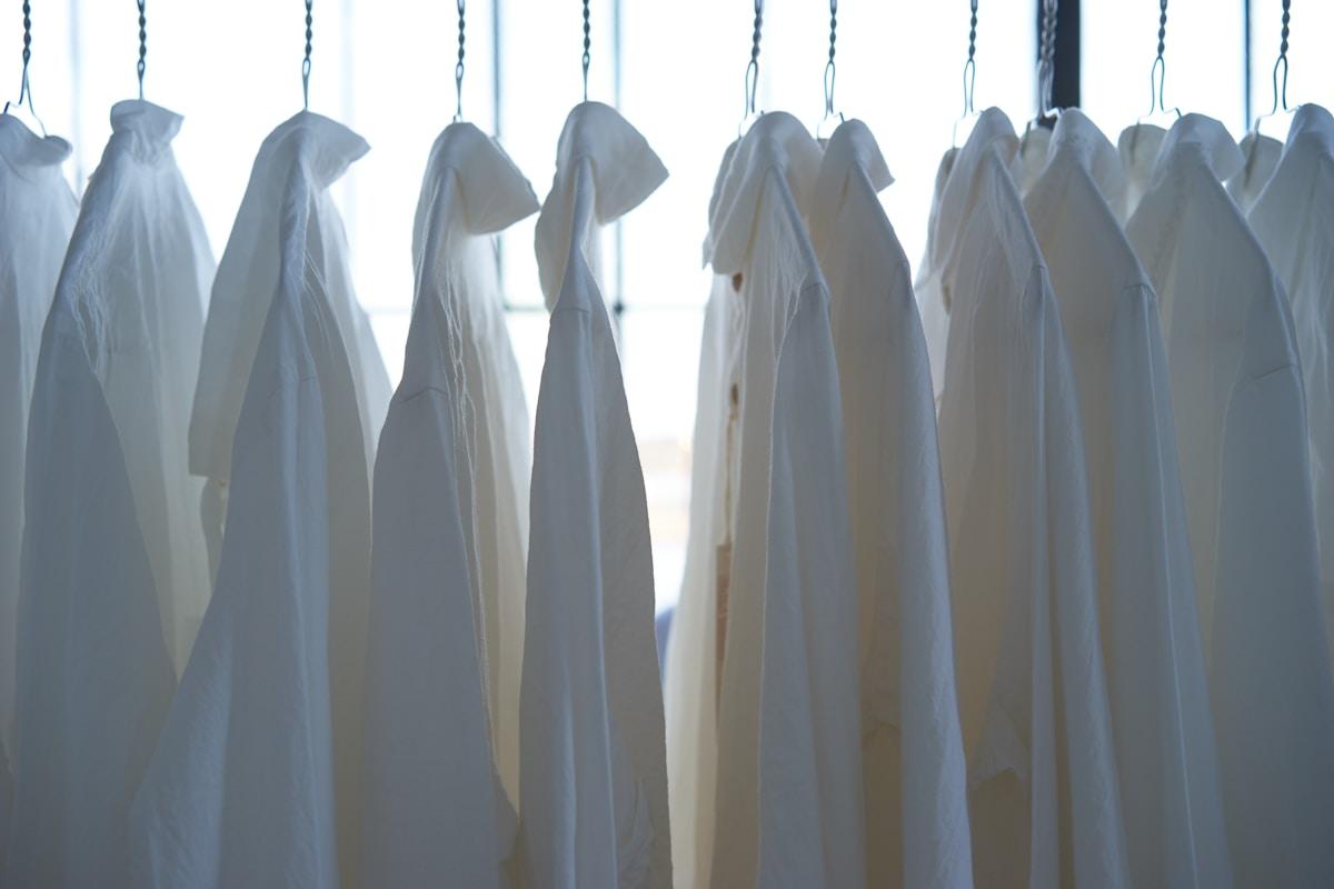 Dress shirts hanging neatly on a clothing rack