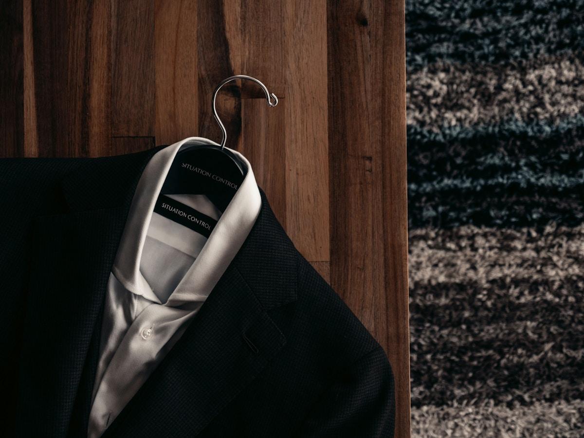 Tailored suit jacket prepared for cleaning and pressing