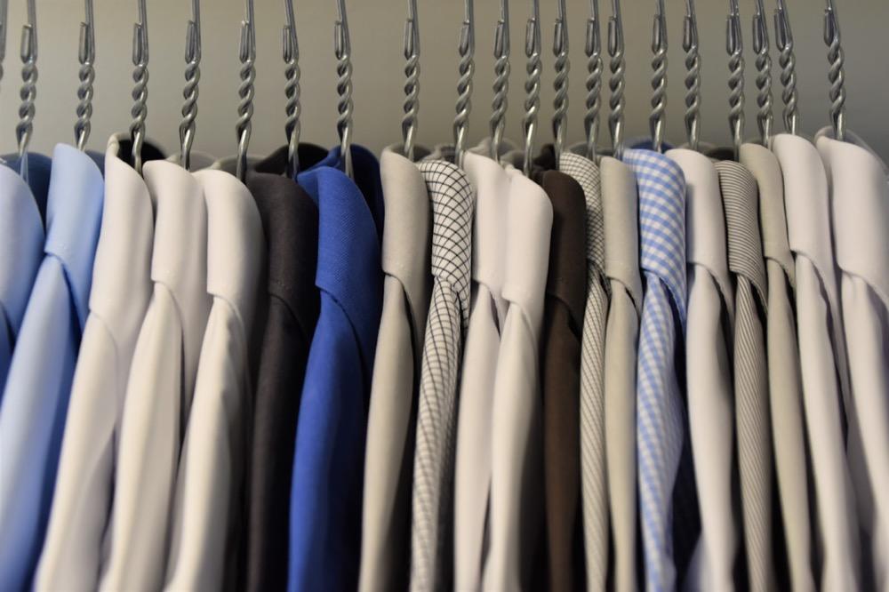 Dress shirts hanging neatly on a rack